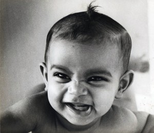 Smiling baby Malini with curl